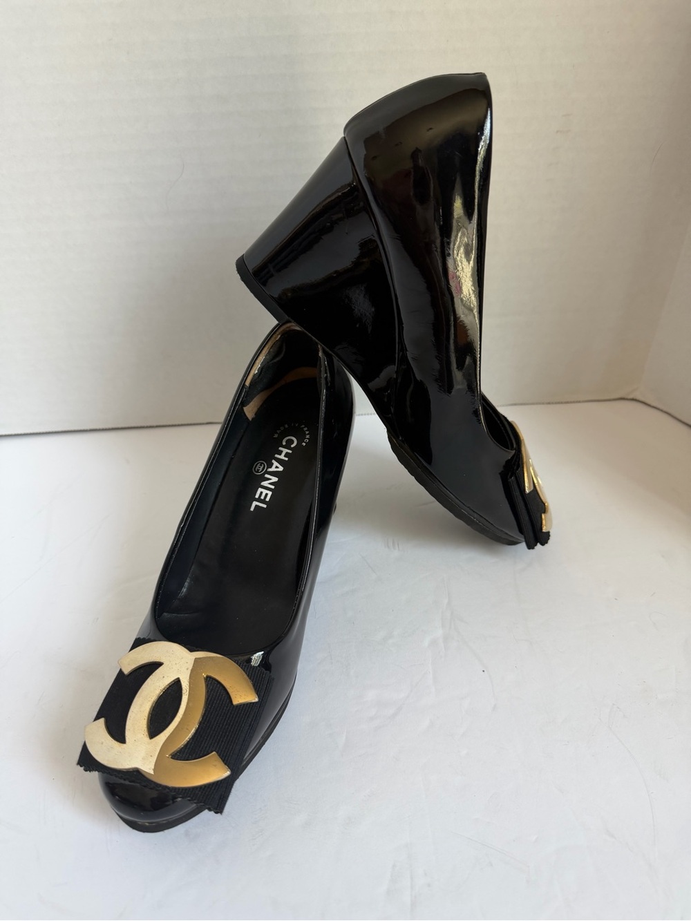 CHANEL Black Patent Wedge Pumps with Gold CC Emblem
